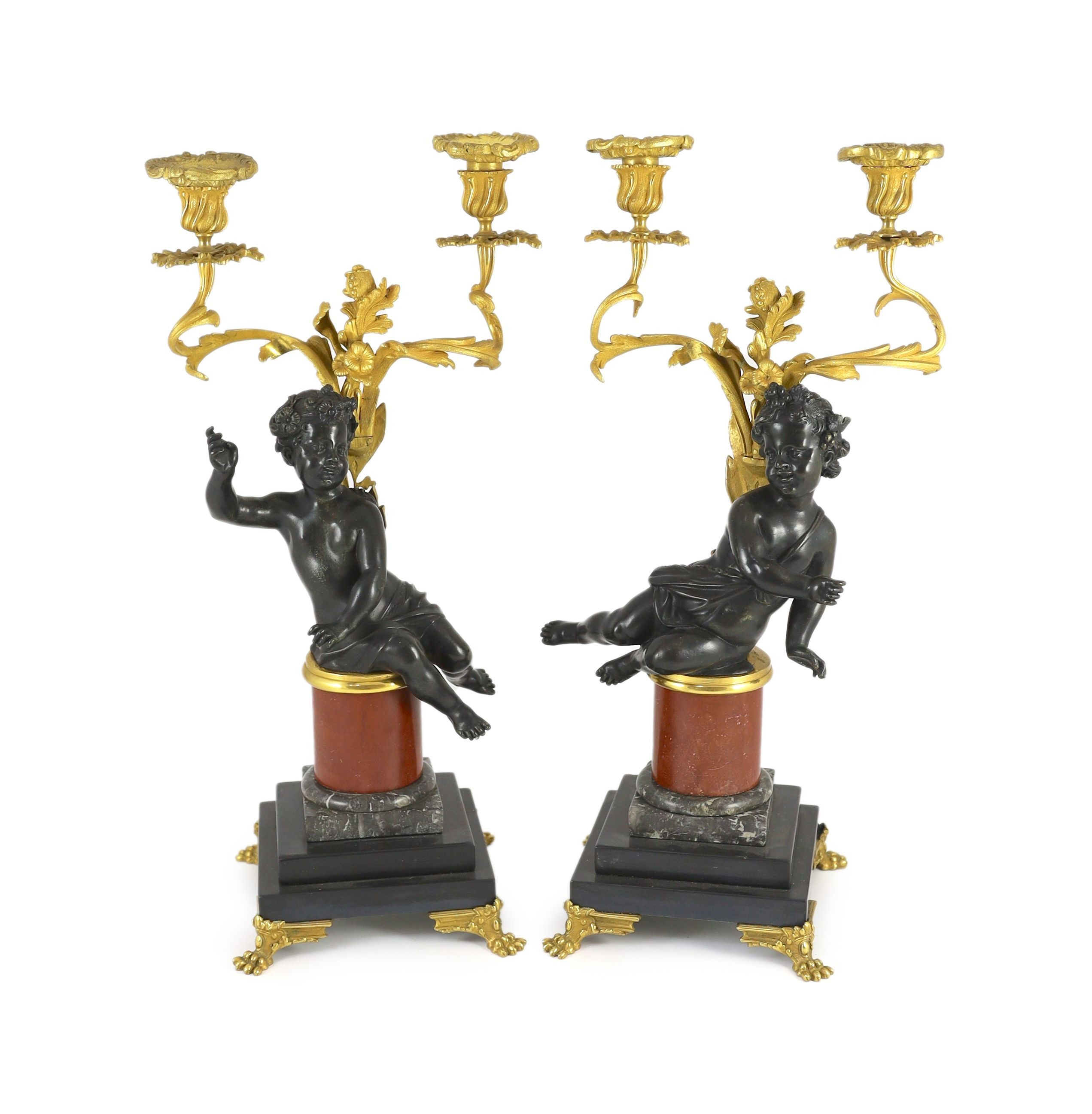 A pair of Louis XVI style bronze and ormolu two light candelabra, 22cm wide, 51cm high
